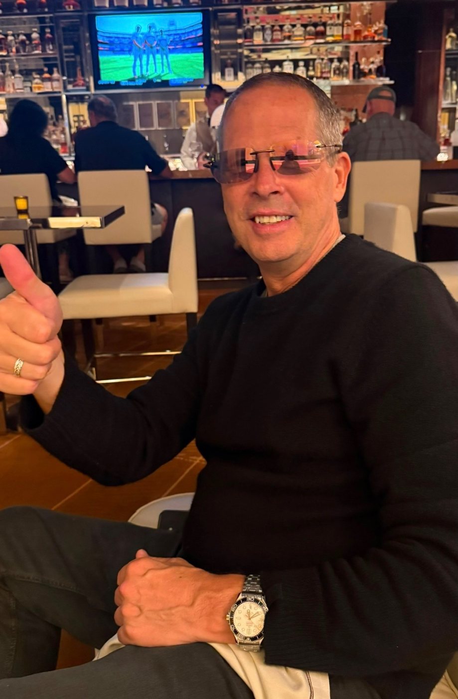 Charlie Hough, thumbs up, off the clock in New Hampshire.