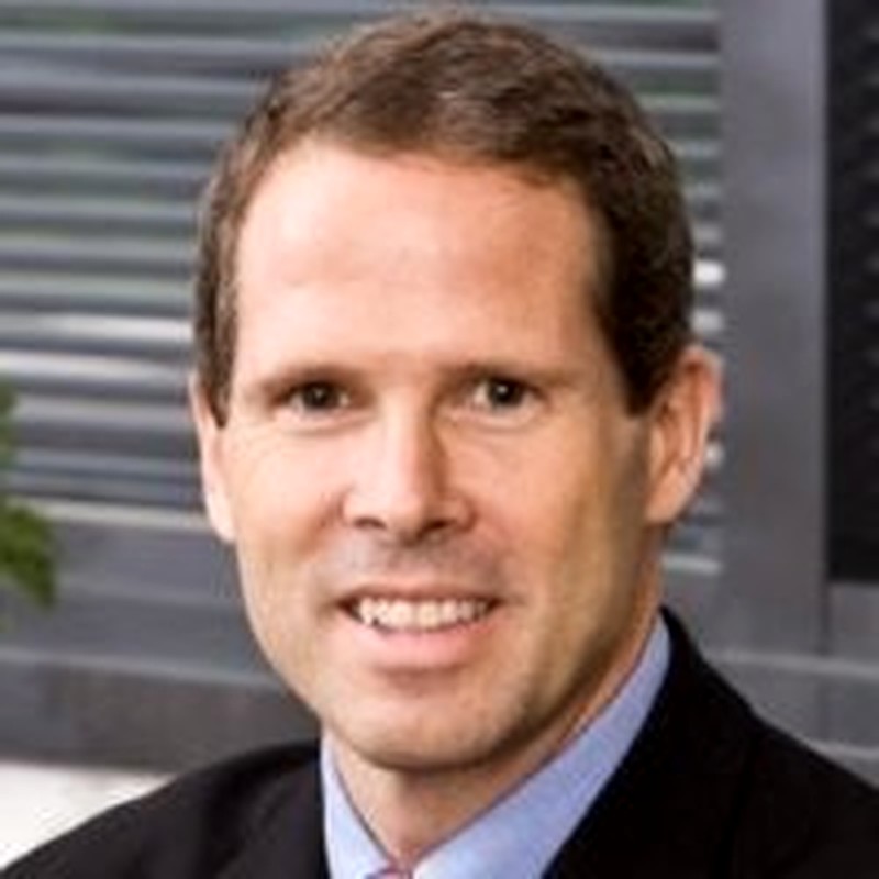 Charlie Hough formal corporate portrait from his pharmaceutical executive years.